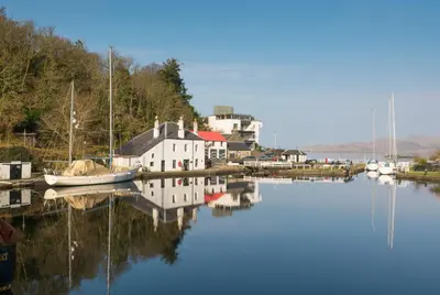 a group of boats are docked in a harbor at Coorie Doon in Cairnbaan
