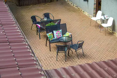 a group of tables and chairs on a patio at Tinto View Apartment in Carstairs