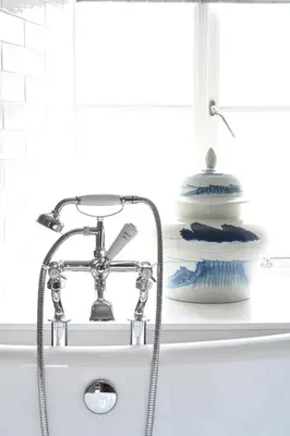 a bathroom sink with a faucet next to a shelf at Laverockbank Steading in Buchanty