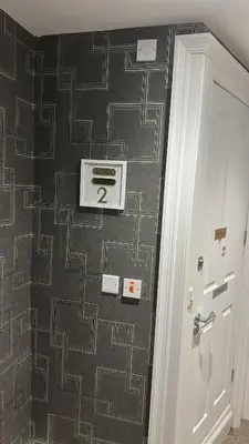 a room with a wall with a pattern on it at IVY House in Edinburgh