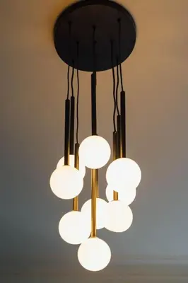 a black and white chandelier hanging from a ceiling at Stylish Stirling Apartment - free parking in Stirling