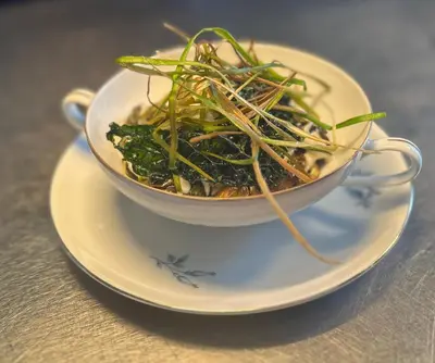 a bowl of food on a plate on a table at Callander Meadows in Callander