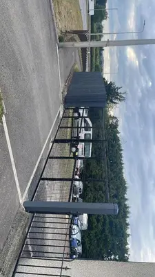 a group of cars parked next to a wall at 4 bed bungalow near Airport in Edinburgh