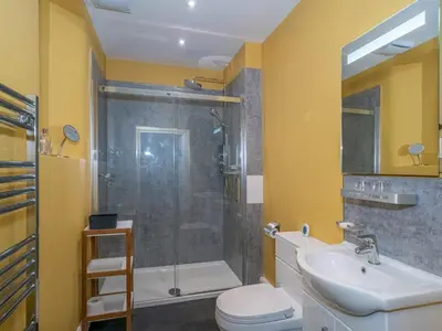 a bathroom with a shower and a toilet and a sink at Superb 3Beds House in Chic area of the City Centre - Pass the Keys in Edinburgh
