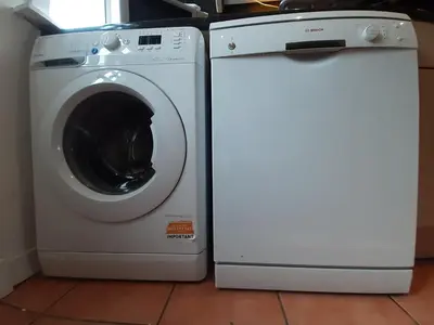 a washing machine and a dryer sitting next to each other at Carvetii - Xavier House - 2-storey sleeps up to 7 in Rosyth