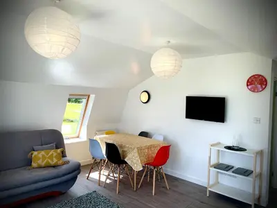 a living room with a table and a couch at Glamping at Shieling Holidays Mull in Craignure