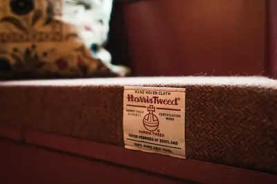 a sign sitting on the side of a mattress at Huntly House - A Residence Like No Other in Glasgow