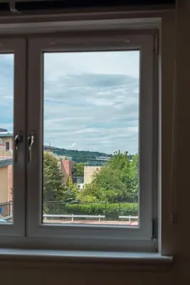 a window with a view of a city at Ground Floor 2 Bed Flat Slateford in Edinburgh