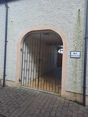 an entrance to a building with a metal gate at B&B at No 4 in Biggar