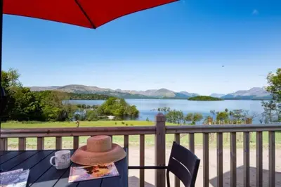 a hat sitting on a table with a view of a lake at The Old Farmhouse in Balloch