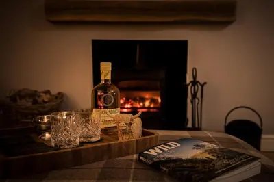 a bottle of wine sitting on top of a table at Ardchyle House in Killin