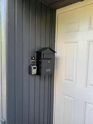 a safe is attached to a wall next to a door at Cedarbank’s - 'Little Art House' in Kirn