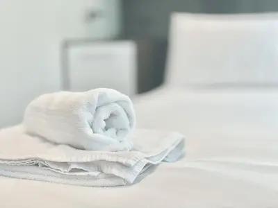 a pile of towels sitting on top of a table at Clyde Villa in Glasgow