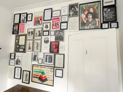 a wall of pictures and photos on a wall at Osborne Place in Rothesay