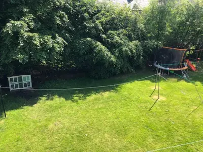 an aerial view of a yard with a net at Light & Spacious Loch Lomond Apartment in Alexandria