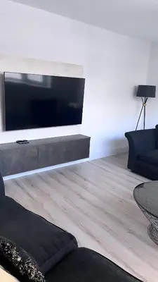a living room with a large flat screen tv at 3 Bedroom House Near City Centre Glasgow Sleeps 7 in Glasgow