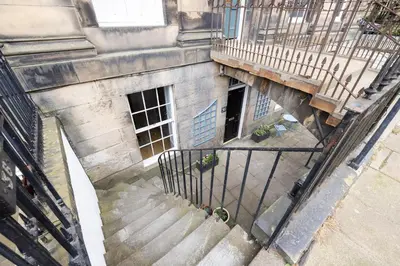 an overhead view of a staircase leading to a building at JOIVY Chic Apartment near Stockbridge Market in Edinburgh