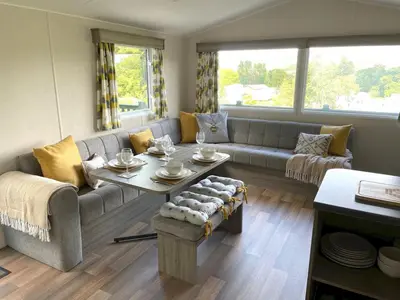 a living room with a couch and a table at Beautiful 3BR Holiday Home in Stunning Location - Pass the Keys in Moffat