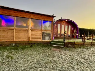 a home with a large window on the side of it at FINN VILLAGE - Loch Lomond Sunset Glamping Pod - Private Ofuro HOT TUB in Drymen
