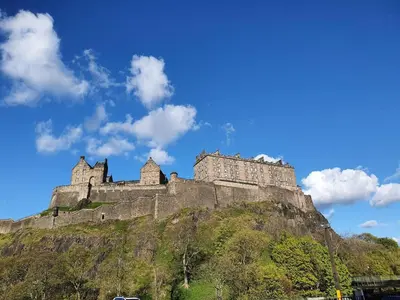 a castle on top of a mountain at Lovely 2 bedroom flat in the heart of the city in Edinburgh