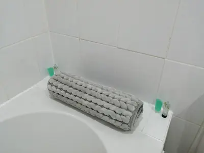 a white toilet in a bathroom with two glasses at Spacious stylish centraly located flat near beach in Largs