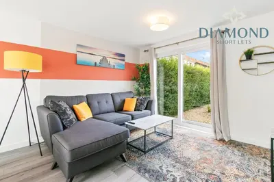 a living room with a couch and a window at Grangemouth, 3 Bed House, Free Parking, Business or Leisure in Grangemouth