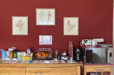a kitchen with a counter with a microwave and a table at Rowan House B&B Rooms & A Self Catering Apartment in Lochgoilhead