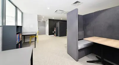 an office with a desk and a table in a room at HFS The Mill House Edinburgh in Edinburgh