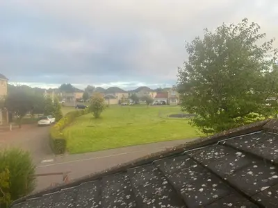 a view of a green park from a window at Caledonia House in Rosyth