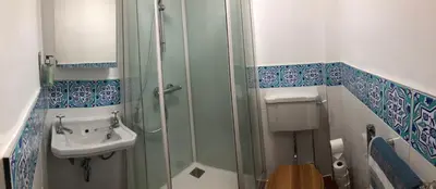 a bathroom with a shower and a sink at Cosy one bedroom flat in city center in Edinburgh