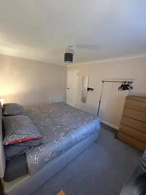 a bedroom with a bed and a dresser at Viewlands house in Auchterarder