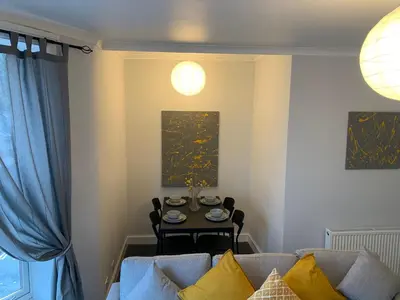 a living room with a couch and a table at Nelson st (YELL) in Largs
