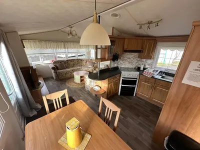 an aerial view of a kitchen and living room in a caravan at Willerby Granada 2-Bedroom Located in Uddingston, Glasgow at Maryville Caravan Site in Uddingston