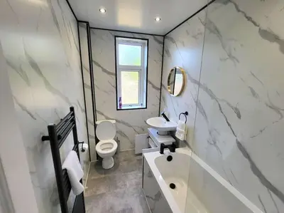 a bathroom with a sink and a toilet and a tub at 4 Bedrooms Apartment By Sensational Stay Short Lets & Serviced Accommodation in Edinburgh