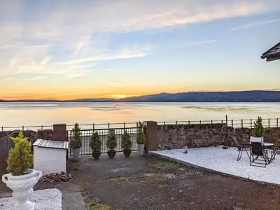 a house with a view of the water at Strathclyde Cottage North in Skelmorlie