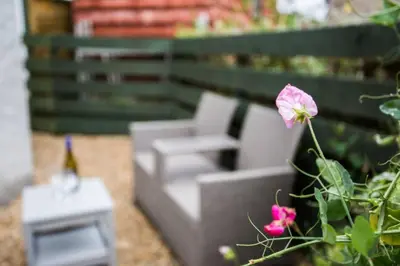 a model of a couch and a pink flower at Ideal Couples base for exploring the Isle of Arran in Shiskine