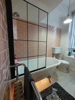a large bathroom with a tub and a toilet at The Flat with the Pink Door in Edinburgh