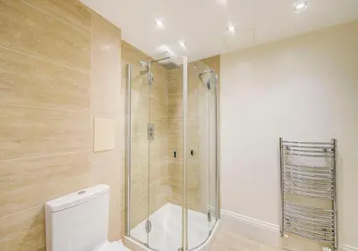 a bathroom with a shower and a toilet at Super central Edinburgh Castle basement in Edinburgh
