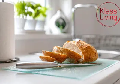 a piece of bread sitting on a plate on a counter at Sanderson Apartment by Klass Living Uddingston in Uddingston