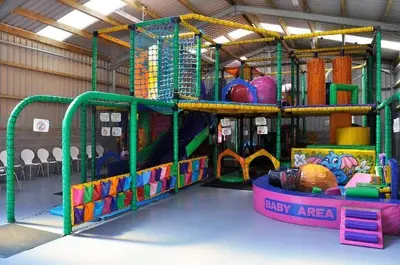 a play room with a bunch of play equipment at 47 Lochview in Stranraer