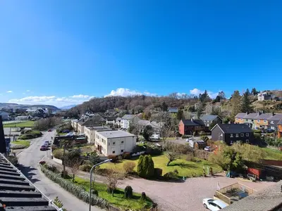 an aerial view of a city with houses and a street at Campbells Loft in Oban