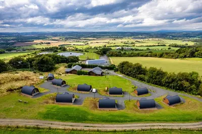 an aerial view of a farm with tents in a field at The Log Cabins at The Vu in Bathgate