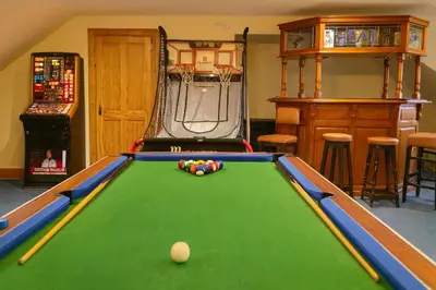 a pool table with a ball on top of it at Gleann Fia House in Arrochar