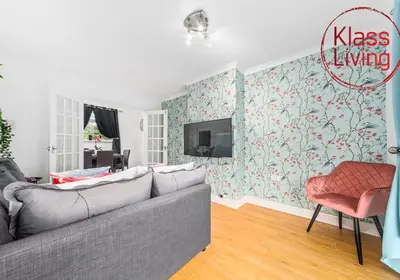 a living room with a couch and a tv at Rothesay House by Klass Living Coatbridge in Coatbridge