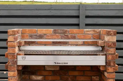 a brick bench sitting on top of a brick wall at Westertonhill Lodge - 3 Double Bedrooms Sleeps 8 With Private Hot Tub Hire Available in Balloch
