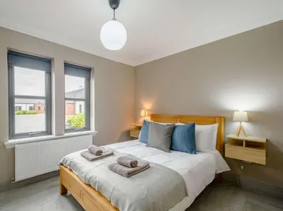 a bedroom with a bed with towels on it at Westertonhill Lodge - 3 Double Bedrooms Sleeps 8 With Private Hot Tub Hire Available in Balloch