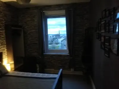 a window in a room with a view of a city at Moorburn Heights in Largs