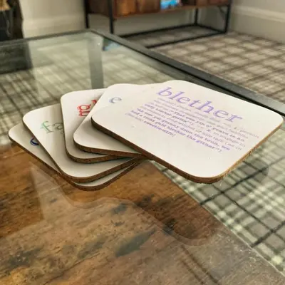 a book sitting on top of a glass table at Laburnam Villa - Luxury 4 bedroom accommodation in the heart of Killin in Killin