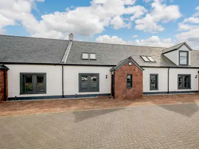 an image of a house with a driveway at Westertonhill Newbuild Lodges with Private Hot Tub Hire Available in Balloch