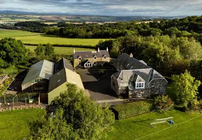 an aerial view of a large house in a field at The Studio at Pitmeadow Farm in Dunning